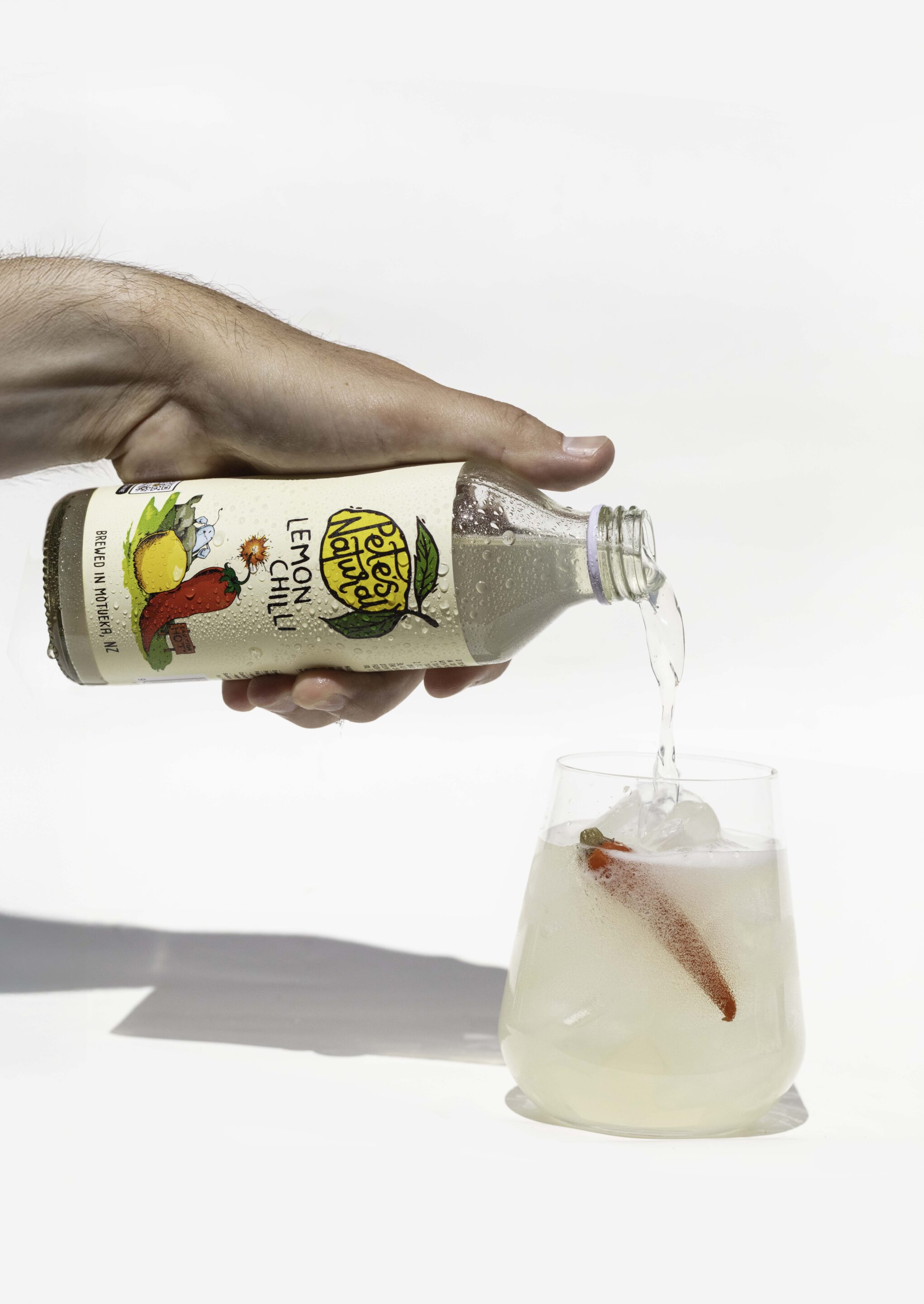 Pete’s Natural Lemon Chilli soda poured into a glass with ice