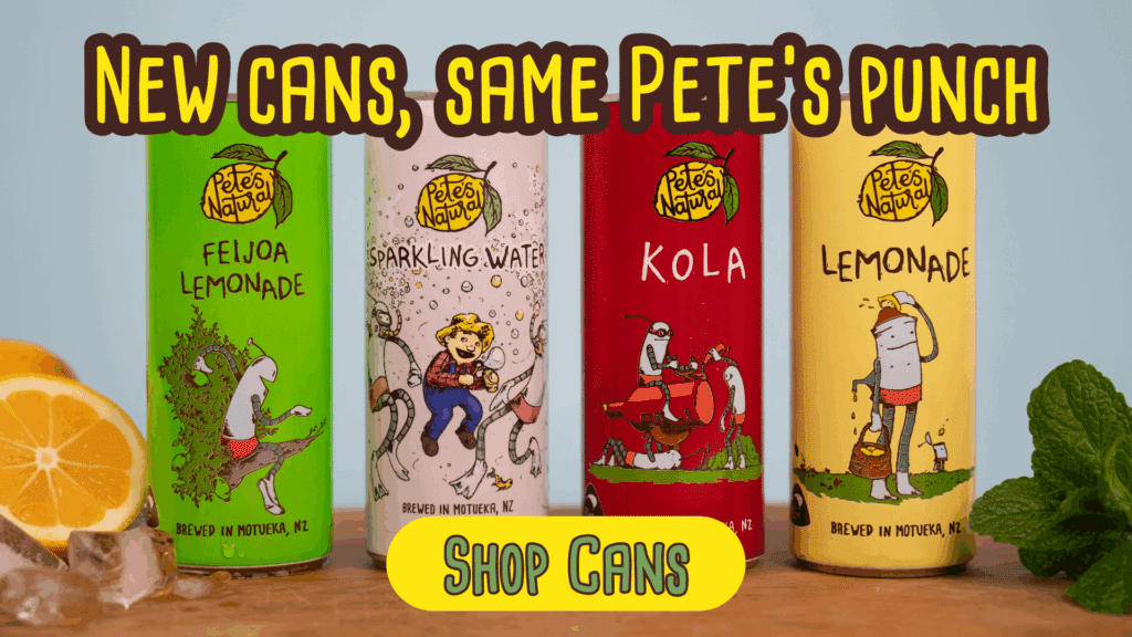 Pete’s Natural new 250 ml cans lined up on a bright wooden table — Lemonade, Feijoa, Kola, and Sparkling Water