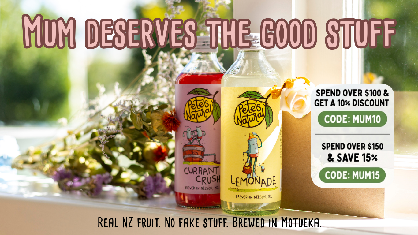 Pete’s Natural Lemonade and Currant Crush bottles on a table with Mother’s Day flowers and discount offer